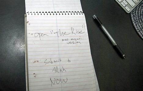 Police released this photo of a spiral notebook found in an office in the Crowley home, open to a page with dried blood on it and the handwritten words, "Submit to Allah NOW." Photo courtesy of the Apple Valley Police Department.